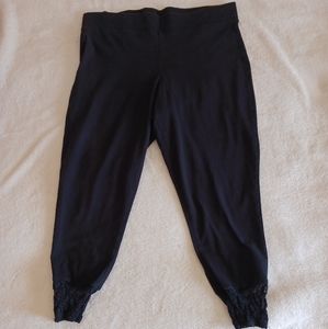 Torrid Black Capris Legging with Lace and buttons on calves.